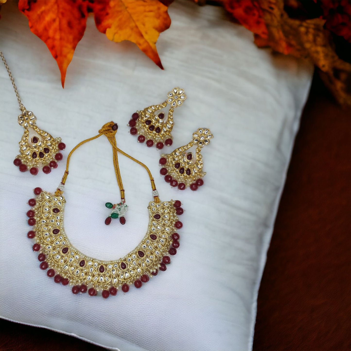 Kundan with hydro crystal necklace earrings mangtika set Maroon in Color