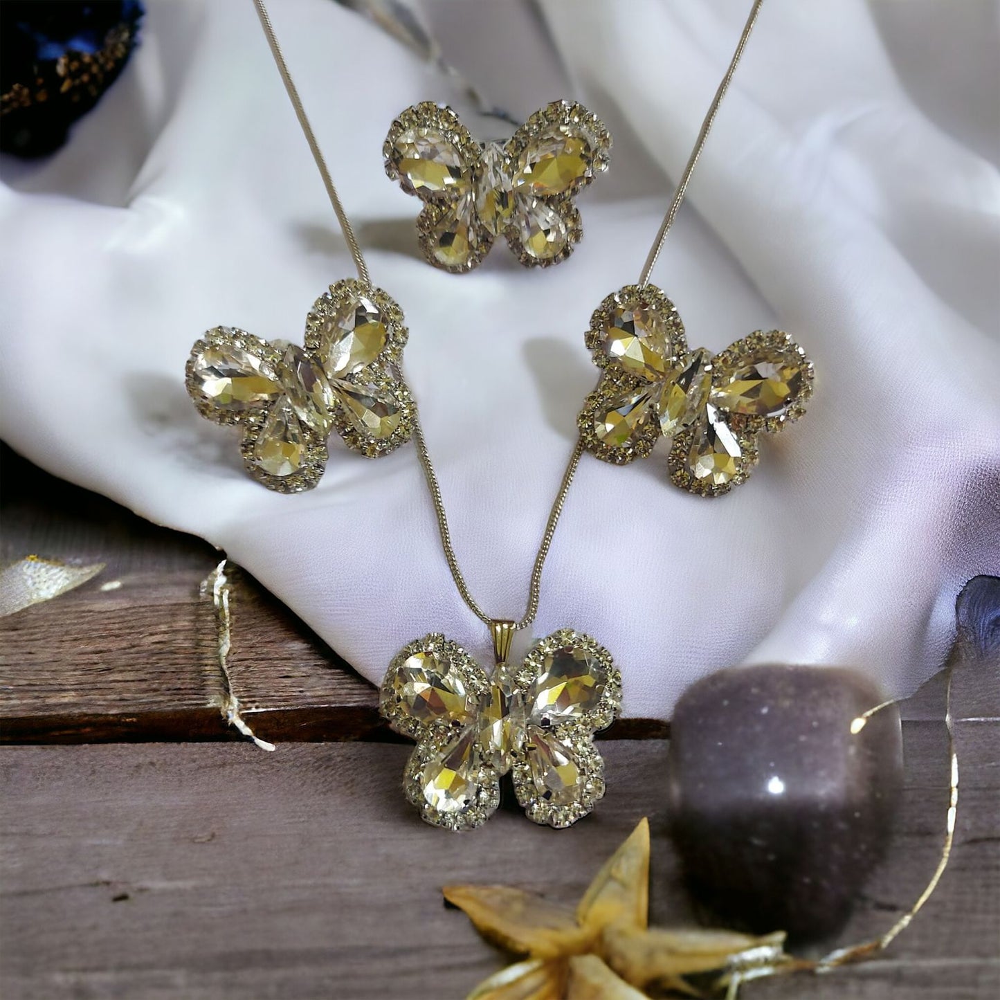 Glass Stone Butterfly pendent set with adjustable fingerring and earrings White in color